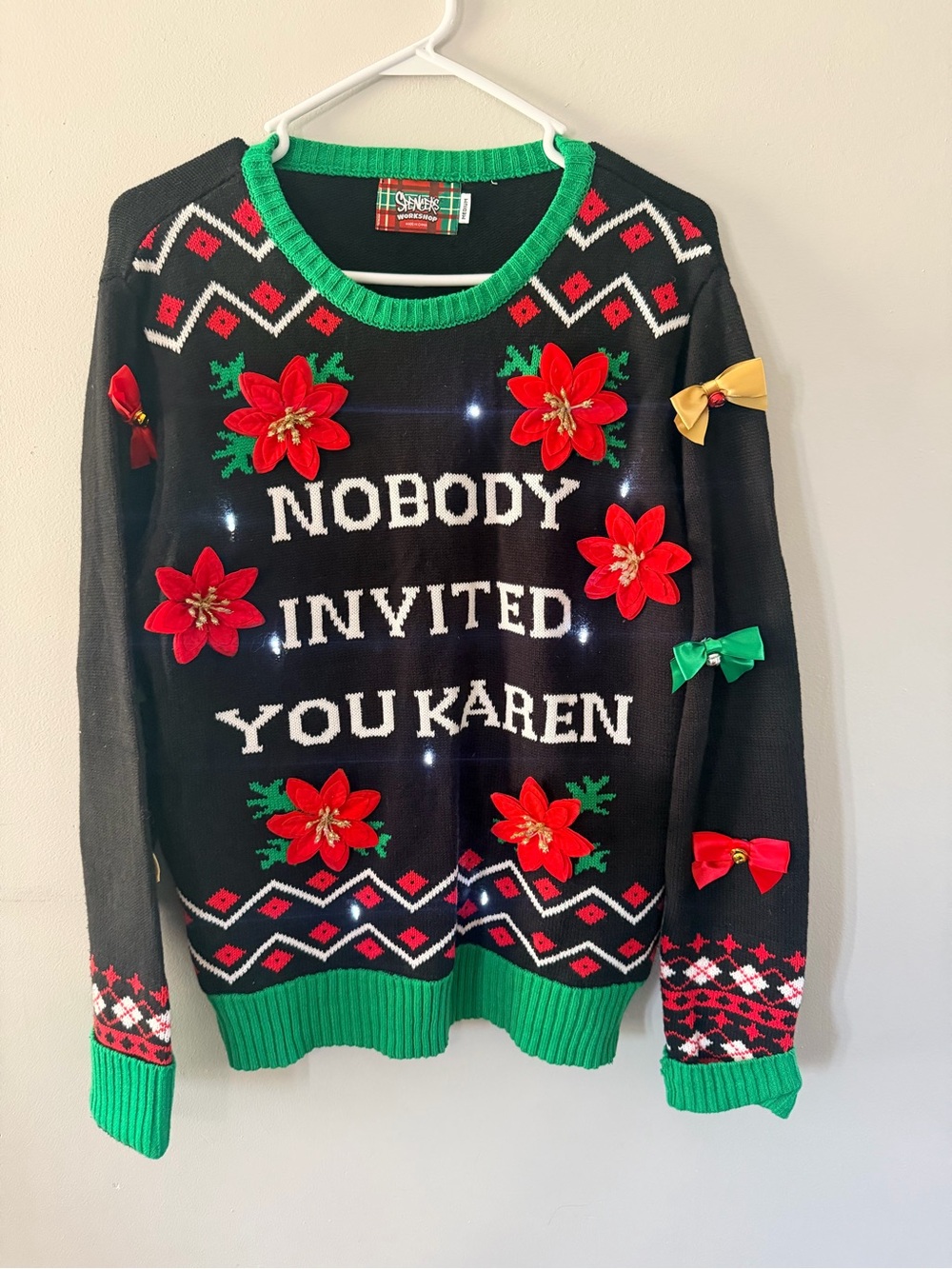 Spencer's Black Holiday Sweater with Red Poinsettias and Green Trim with lights